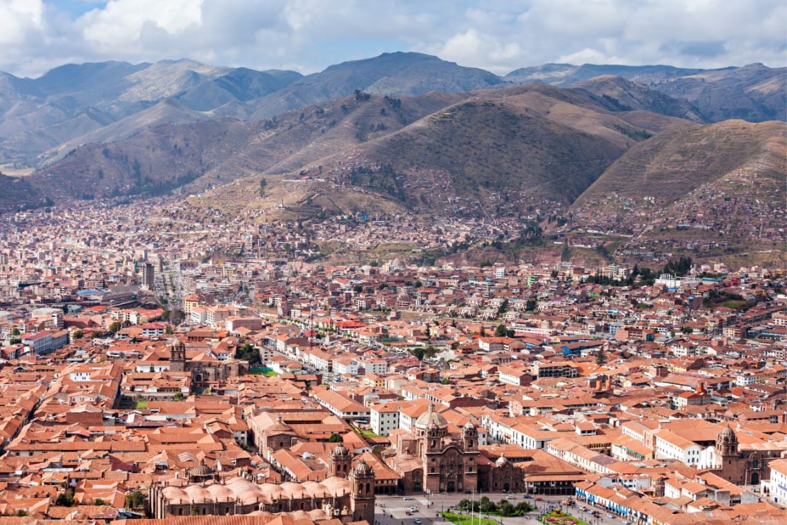 View of historical center of Cusco, Peru surrounded by mountains