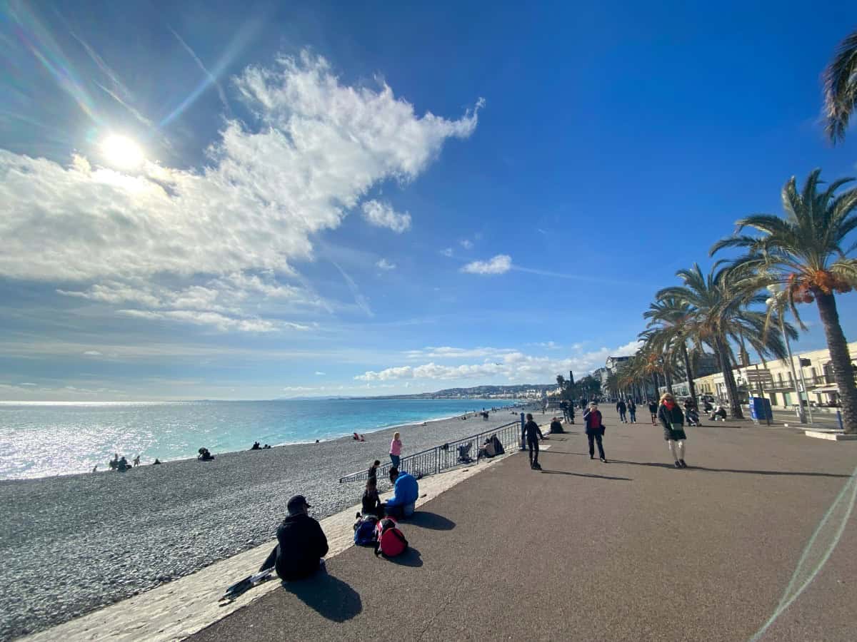 The Promenade des Anglais in Nice, France during a visit to Nice in the winter with the sun shining and palm trees