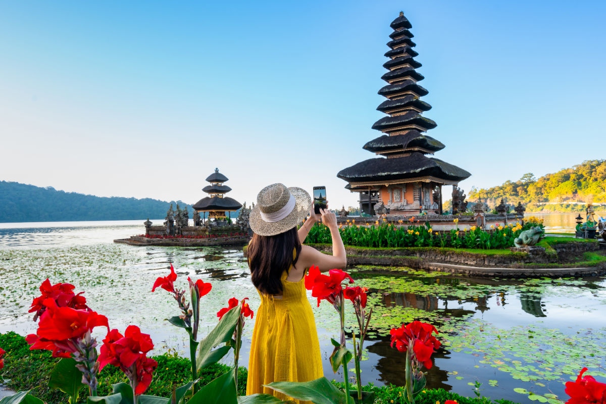 Woman Stands at Ulun Danu Beratan Temple in Bali.jpg