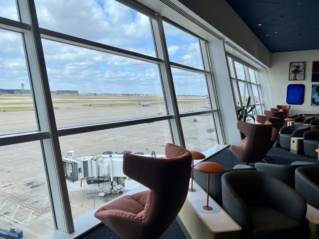 capital one lounge seats overlooking the airport runway