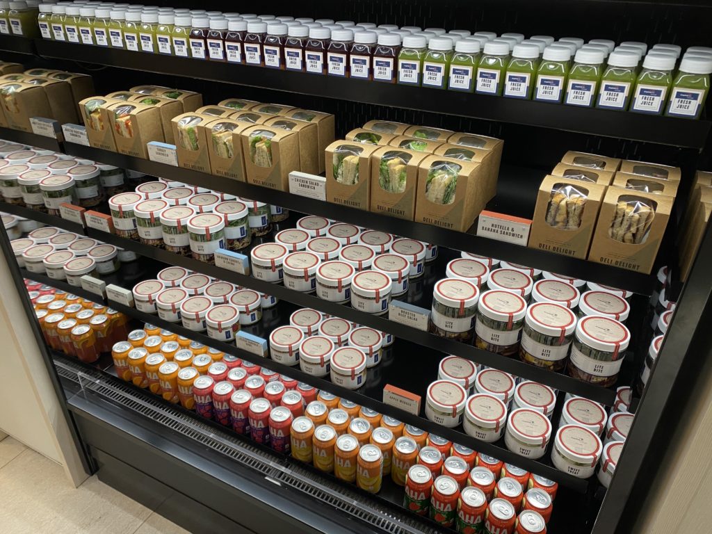 sandwiches, salads, drinks, and juices in the capital one lounge grab and go section