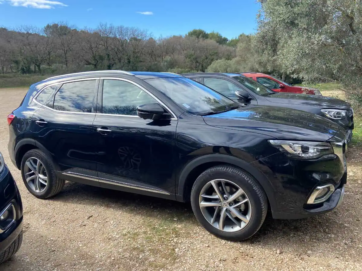 The car we rented in France for our Provence itinerary road trip; a large black sedan