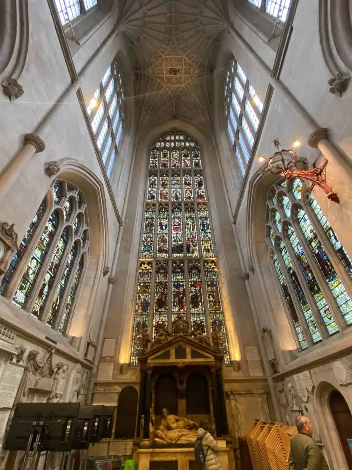 inside of Bath Abbey with tall stained glass windows