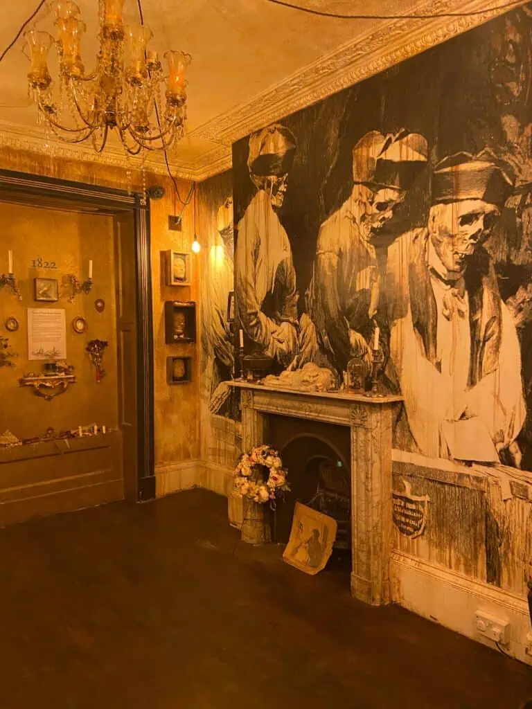 A painting of skeletons over a fireplace in Mary Shelley's House of Frankenstein in Bath, England