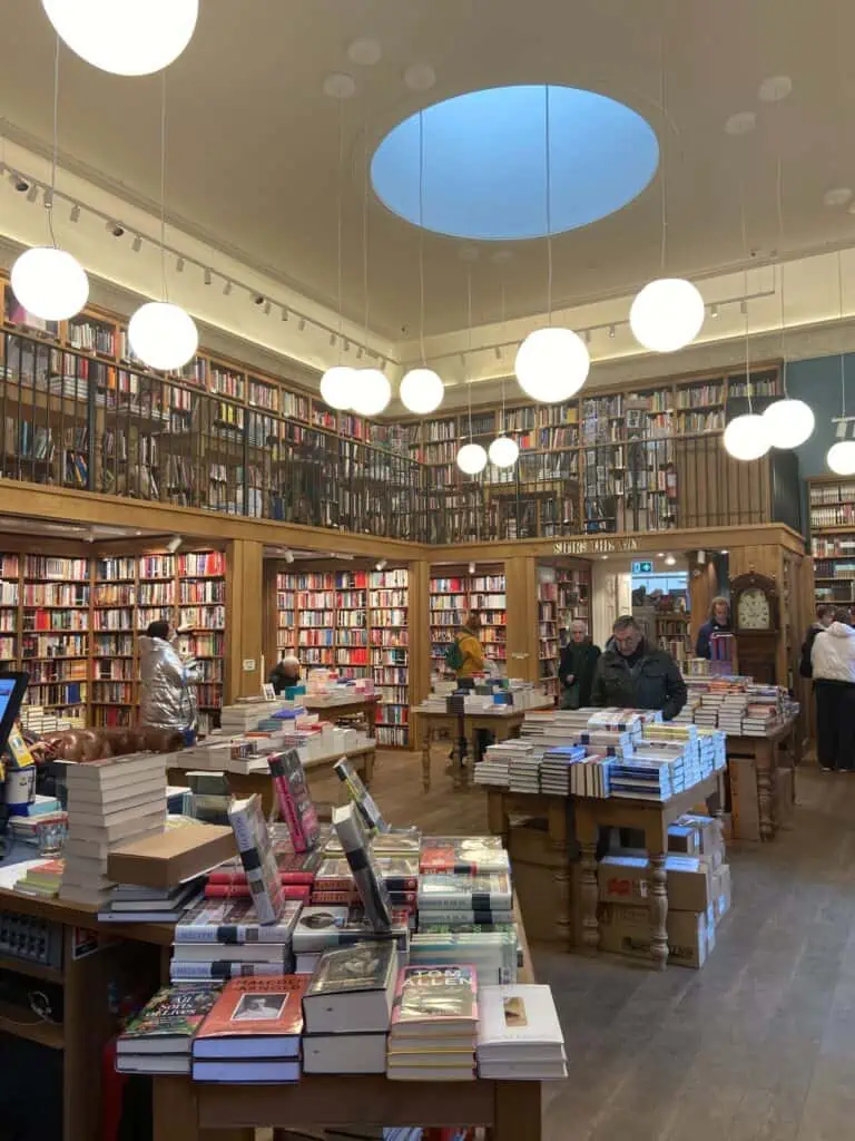 Inside Topping & Company Booksellers of Bath with huge stacks of books