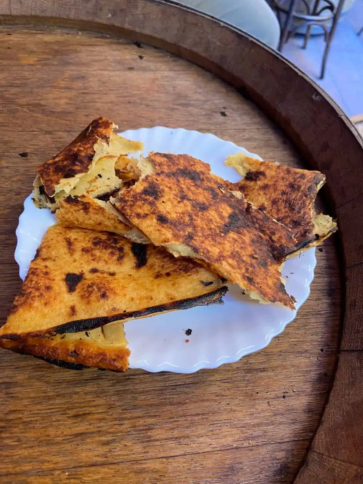 Slices of socca bread on a plate