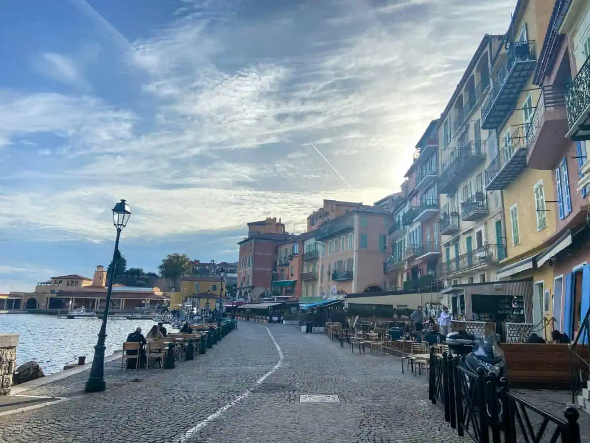 Line of restaurants and colourful buildings along the coast of Villefranche-sur-Mer near Nice, France