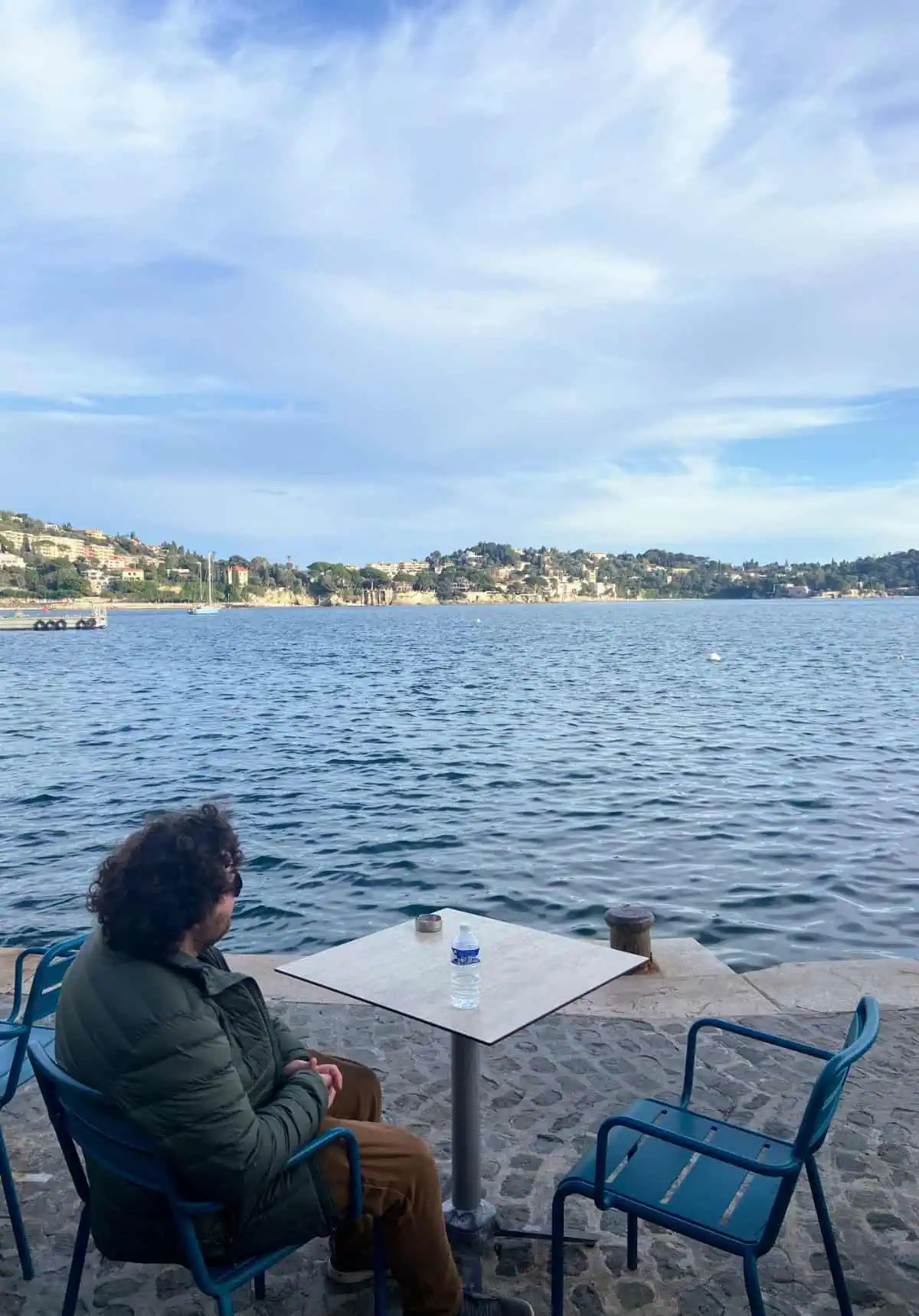 Colin sitting by the water in Villefranche sur Mer