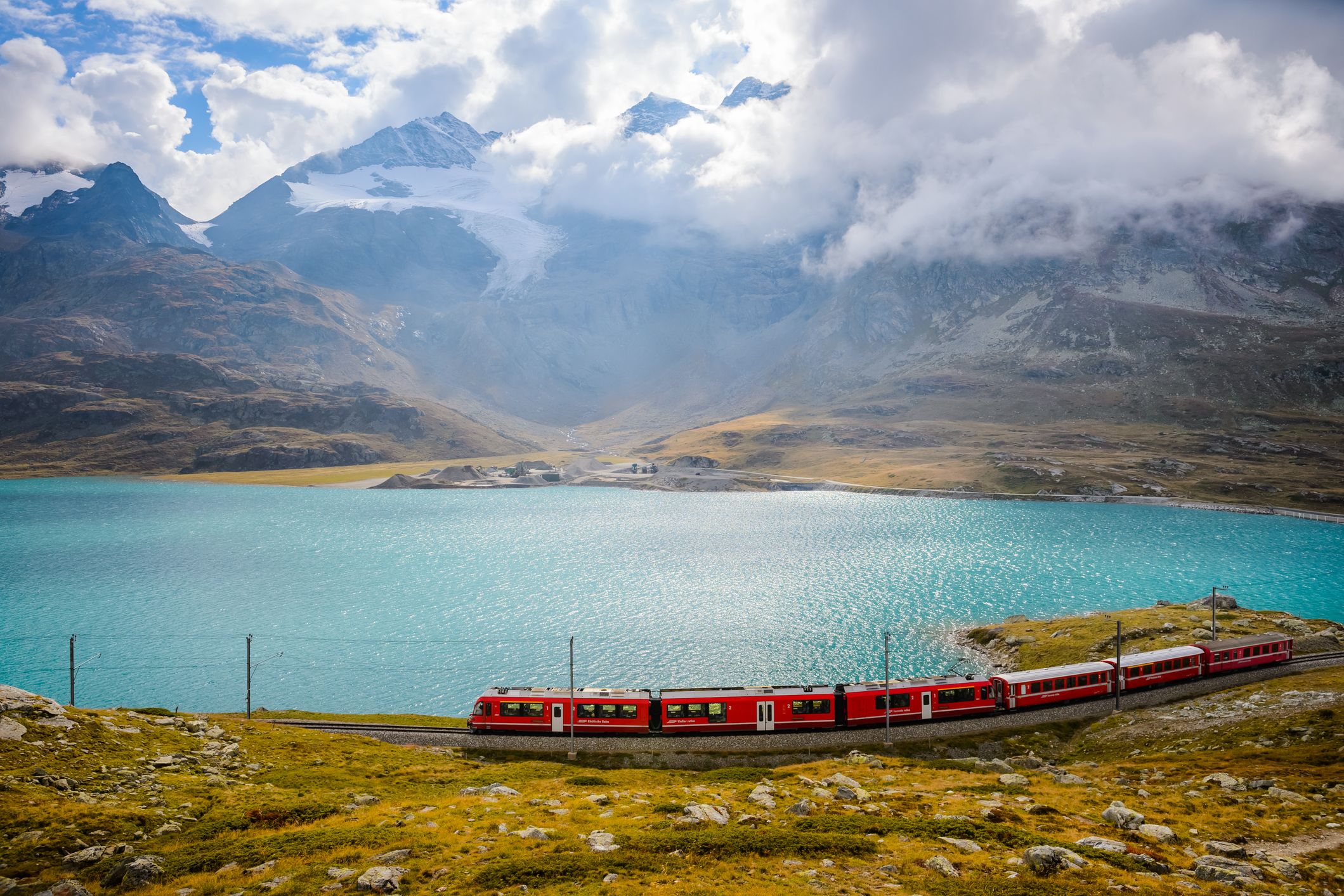 overlooking view of train running on the bernina railway in switzerland