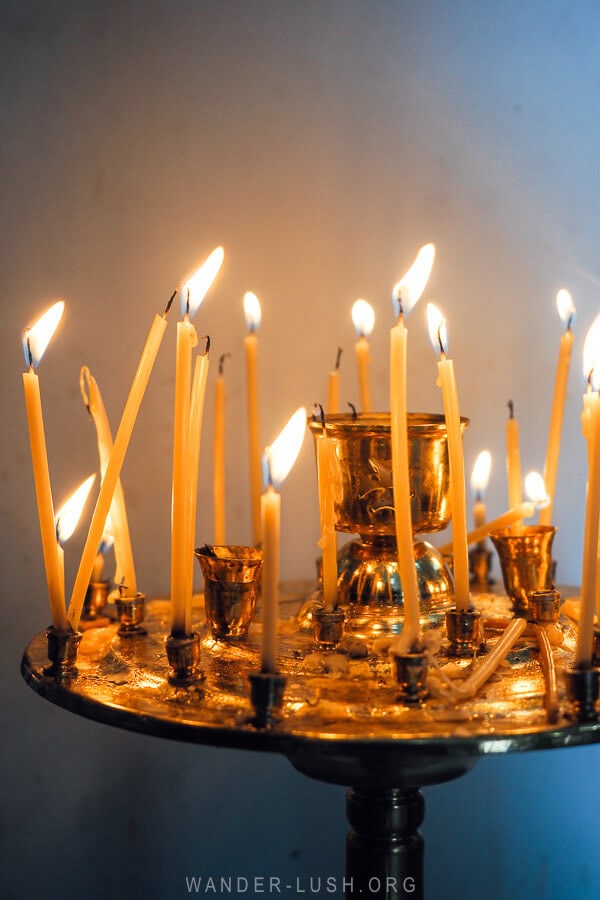 Votive candles lit inside an Orthodox Church in Georgia on Epiphany day.