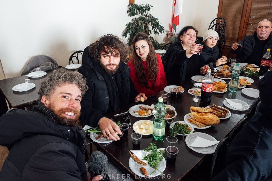 People gather around a table for a communal feast on Epiphany Day in Javakheti, Georgia.