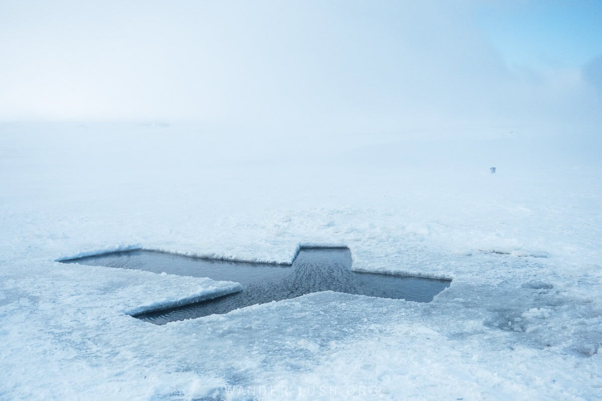 A hole in the shape of St Nino's Cross cut from the frozen surface of Paravani Lake in Javakheti, Georgia.