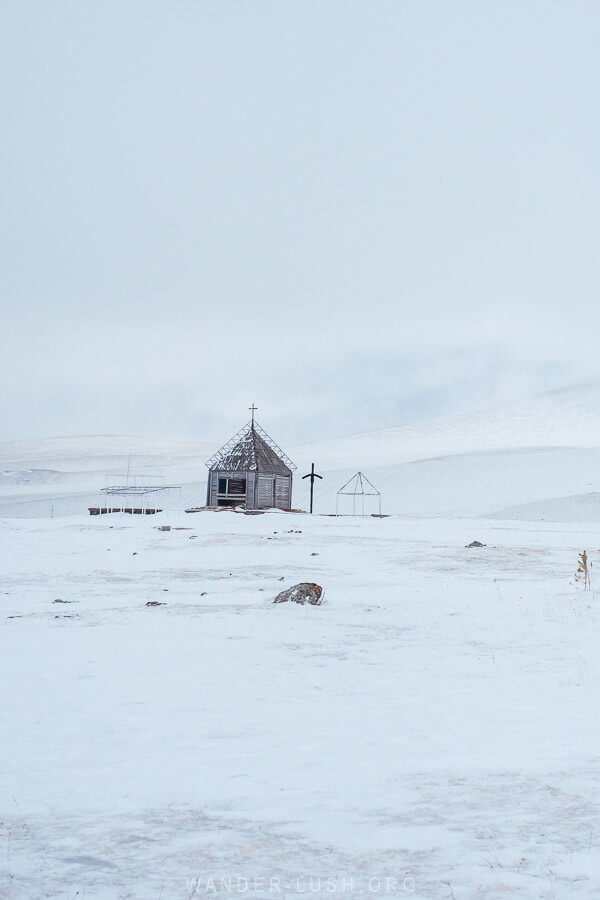 A tiny church on the shore of Lake Paravani in winter.