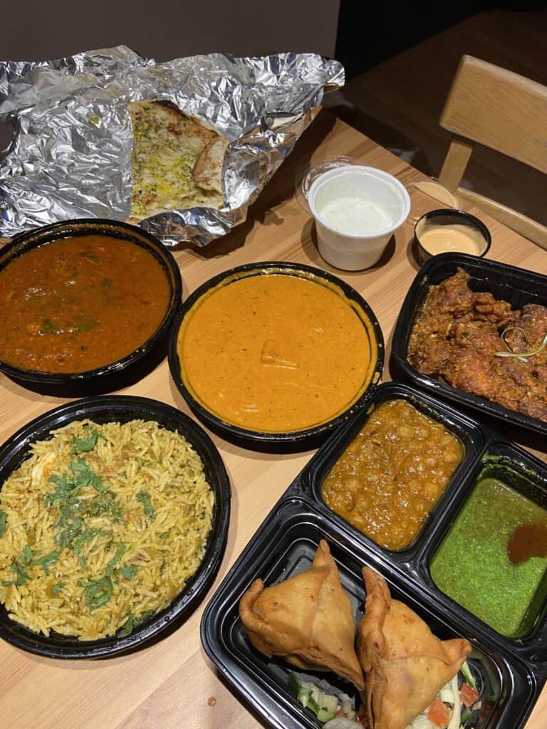 Where to Eat in Yaletown, Vancouver 26 Takeout curries and rice on our table from Tasty Indian Bistro, Yaletown, Vancouver